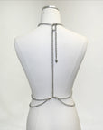 Adjustable bodychain harness designed for festival outfits. Versatile and easy to style, adding structure and shine to rave looks.