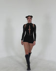 Video of black Rebel Romper rave outfit try-on featuring sleek festival one-piece style.