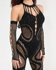 Close-up of Midnight Jumpsuit showing rhinestone sparkle, star embellishments, embossed chest detail, and mesh knit fabric
