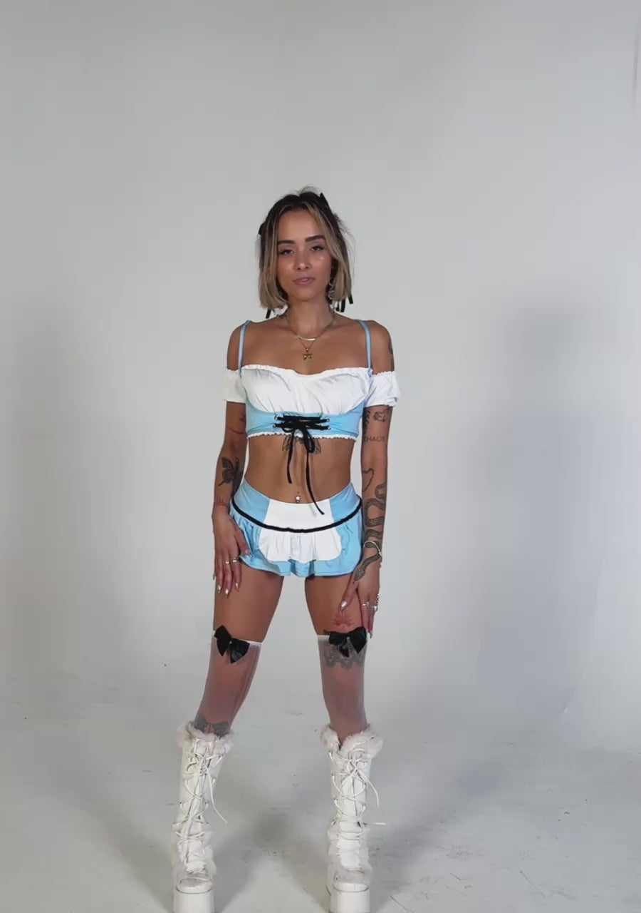 Video: Alice in Wonderland rave outfit try-on featuring blue crop top and mini skirt.